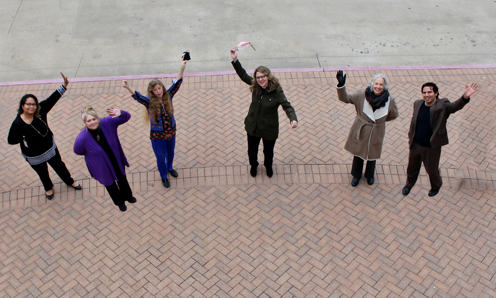 TSBVI staff standing outside and waving