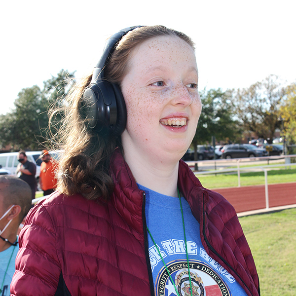 Student with headphones during run