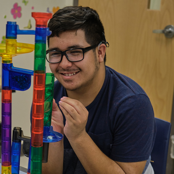 Student playing Marble Run