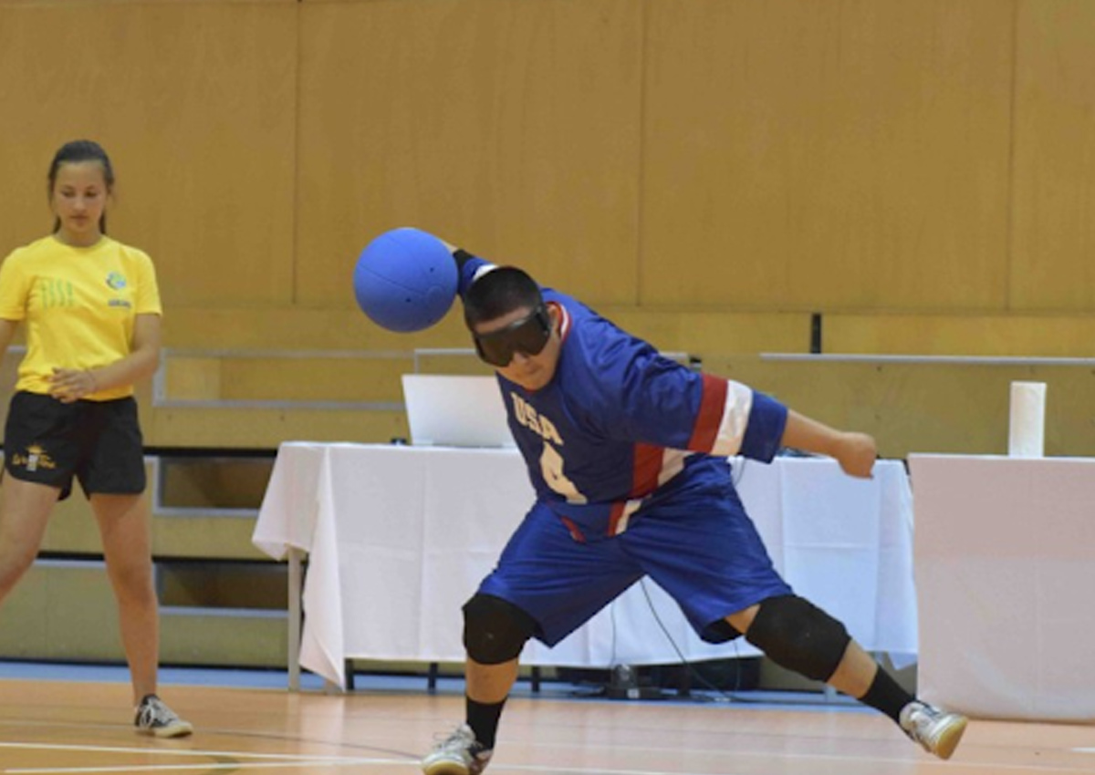 Image of student throwing a ball during a game