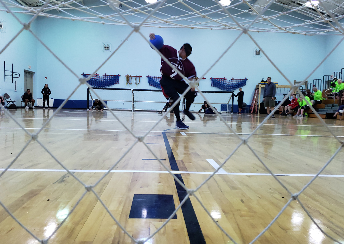Texas boys team player throwing the ball at the USABA National High School Championship in Florida.