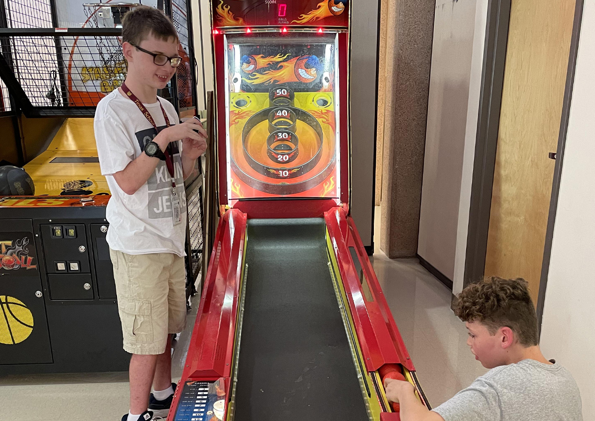 Students play skee-ball at the recreation center.