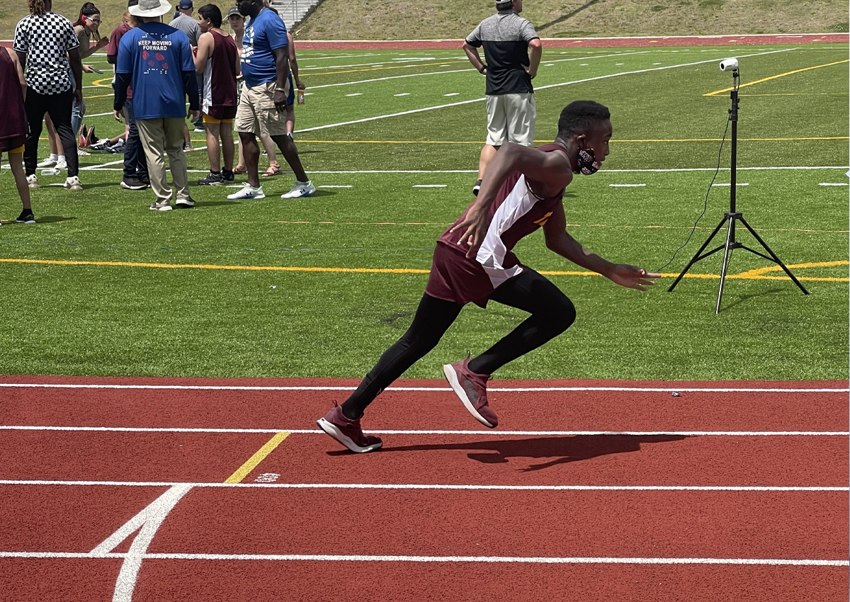 Student running on track at SCASB