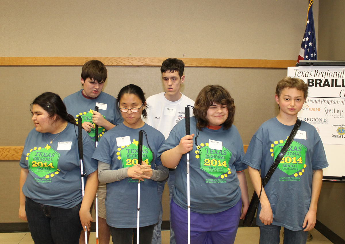 Six adolescents wearing matching gray Braille Challenge 2014 shirts stand in a group.