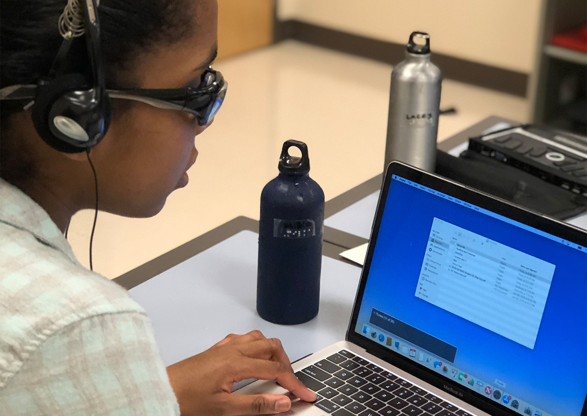 Student using navigating laptop with JAWS