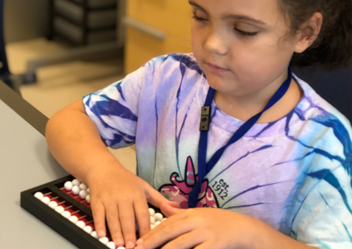 Student using abacus