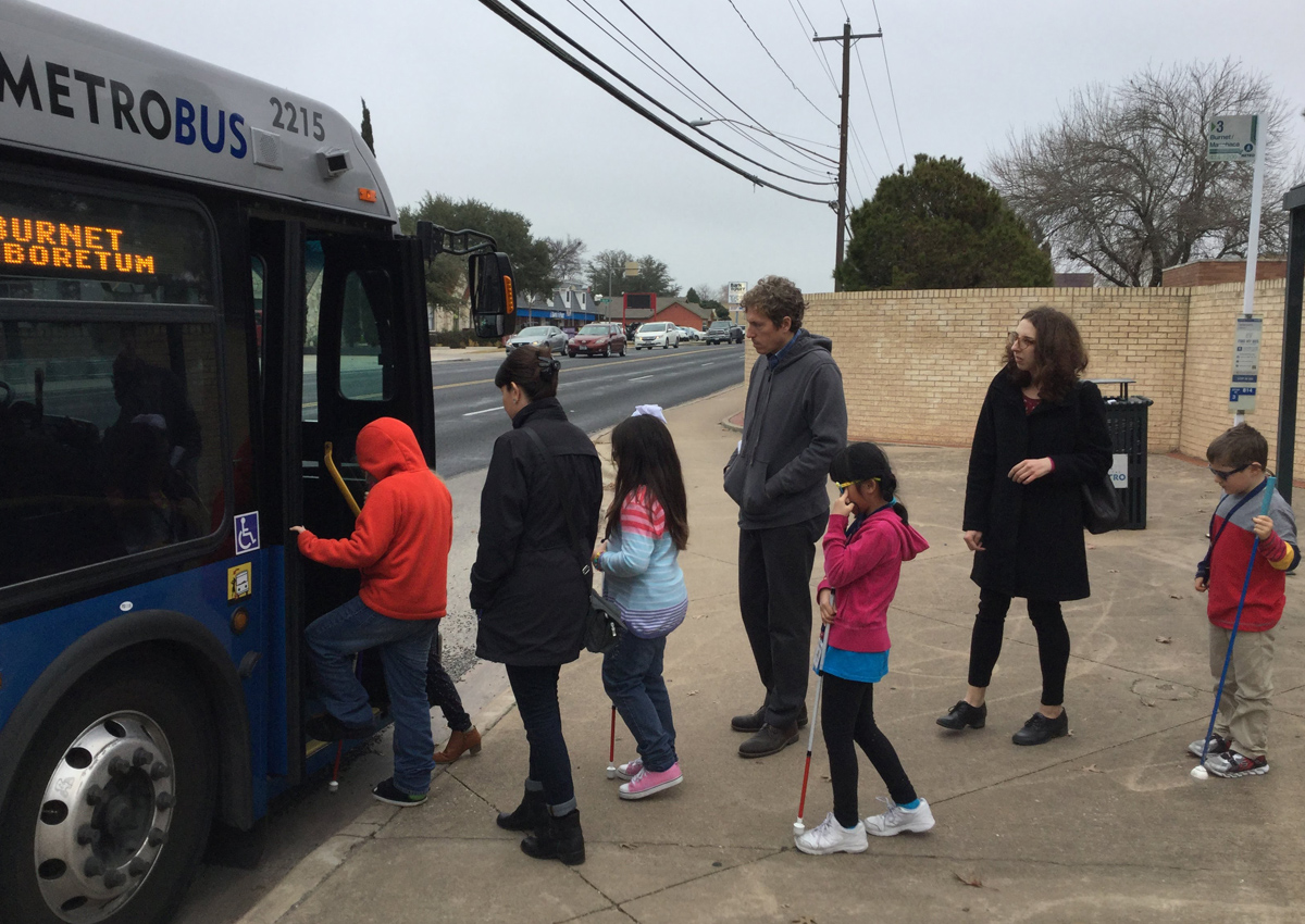 Students boarding a Cap Metro bus