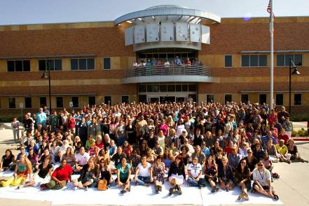 Photo of staff in front of new main building