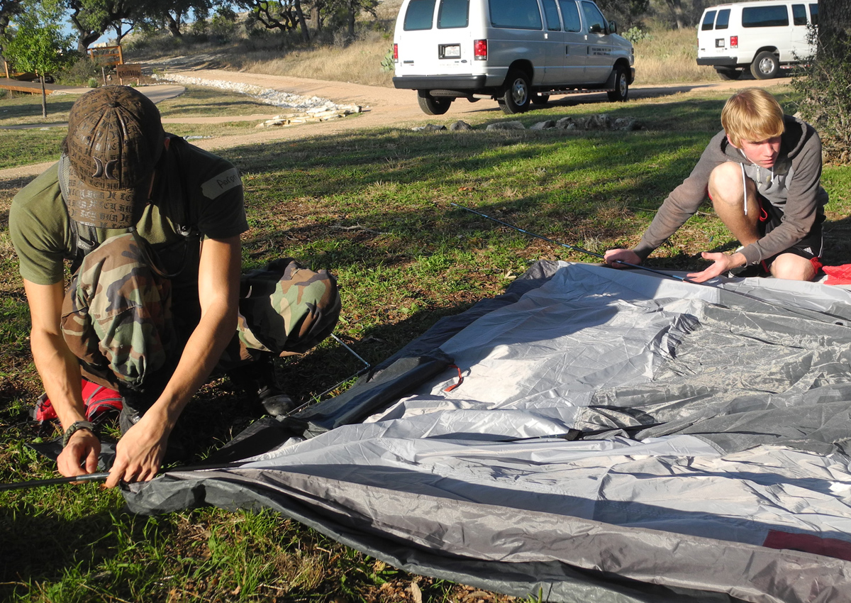 Students pitching a tent together