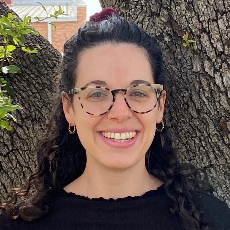 image of STP staff, Annie Biondi standing in front of a tree on campus