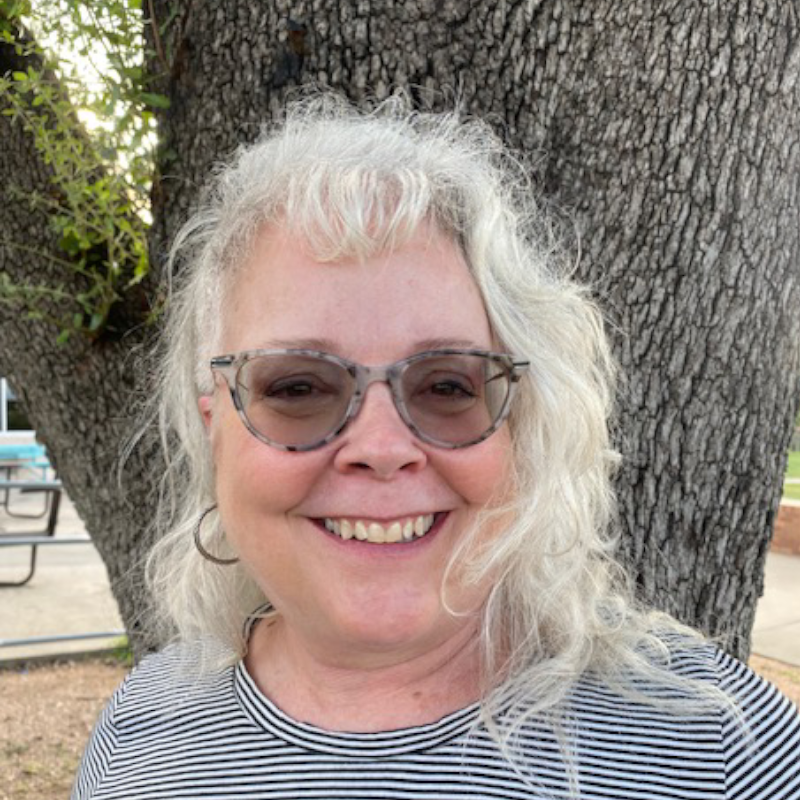 Image of Eden in front of tree