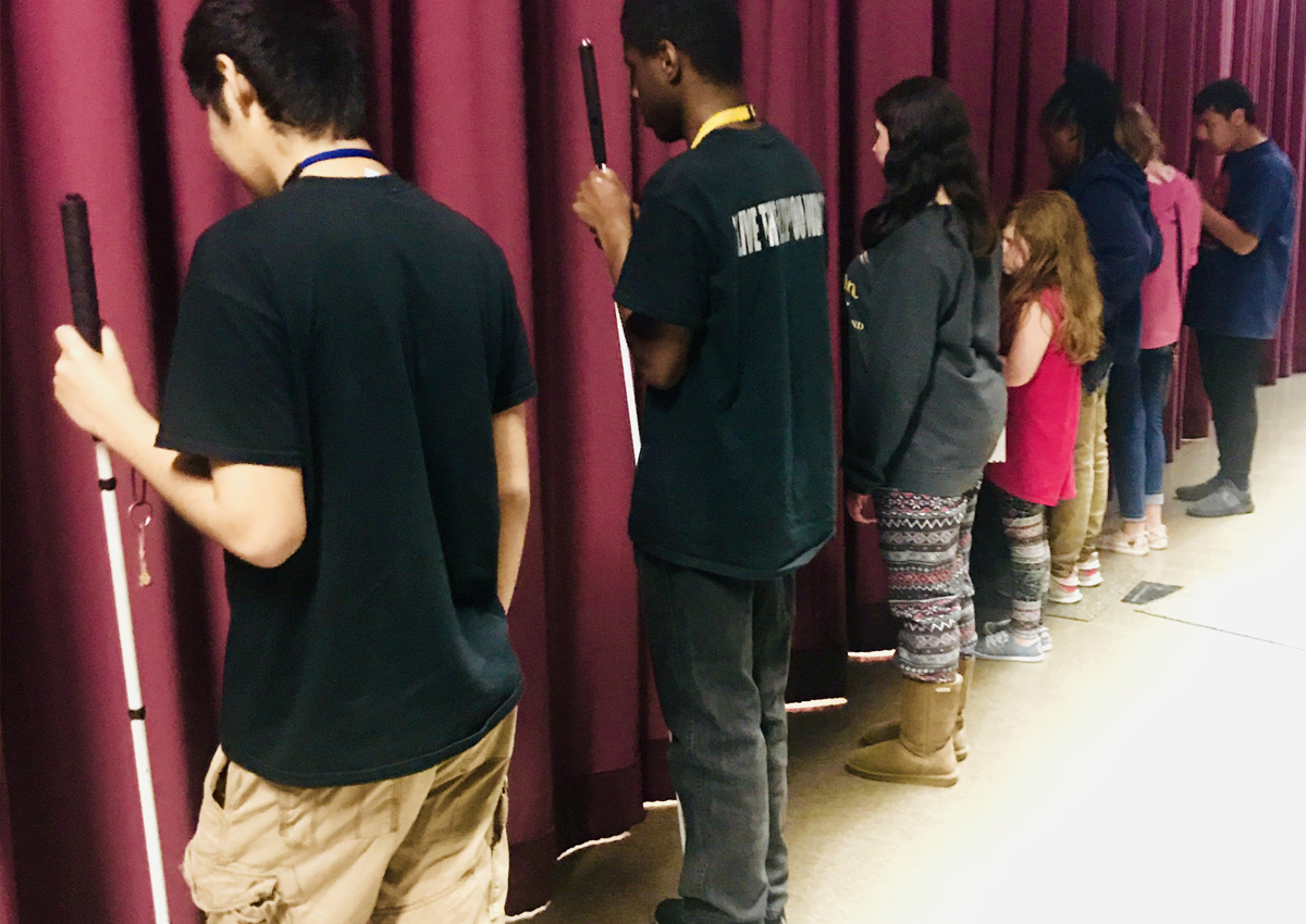Cast of Beauty and the Beast rehearses curtain call.
