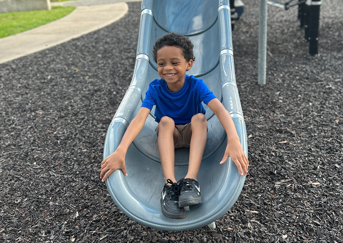 student on slide