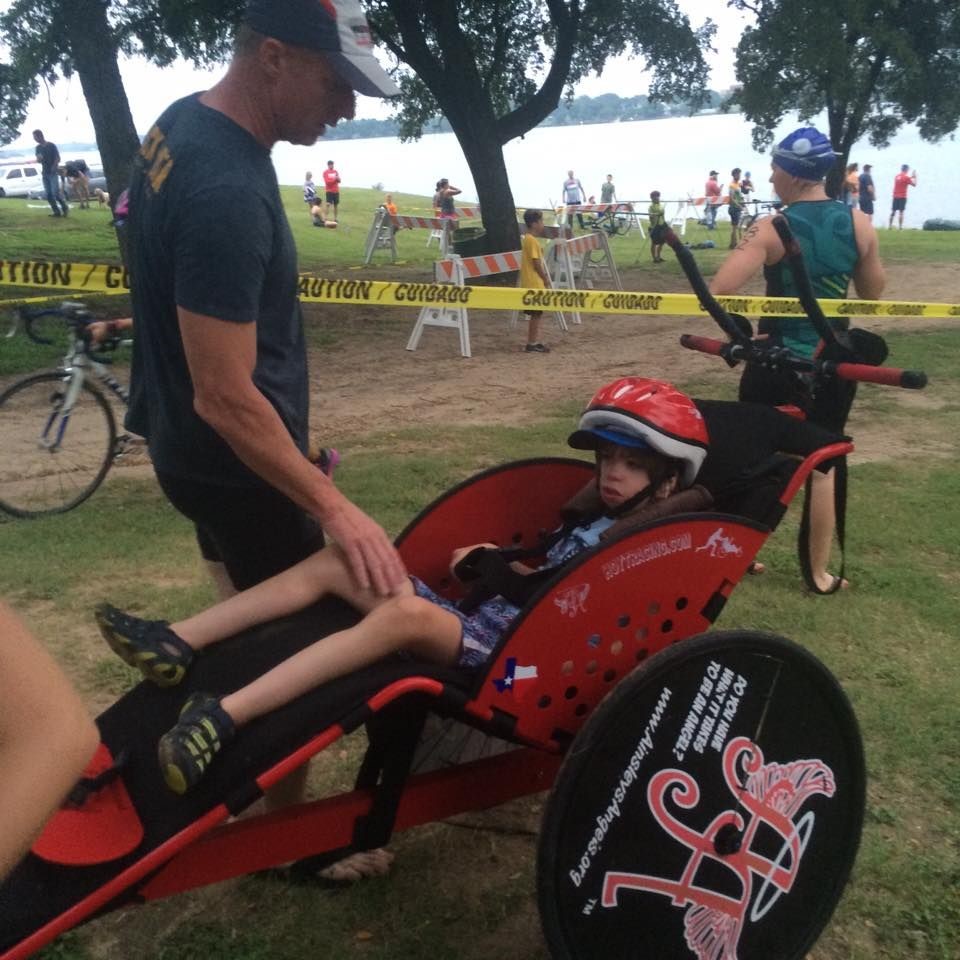 JD sitting in a bicycle trailer