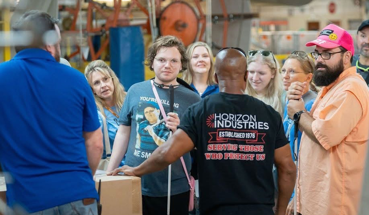 Students and staff tour a production facility at Horizon Industries.